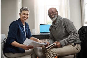 Mature couple reviewing finances at home 